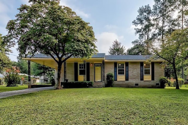 single story home featuring a front lawn and a carport