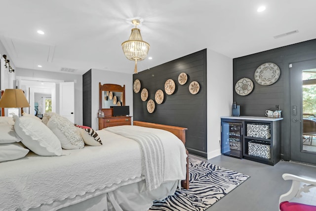 bedroom featuring finished concrete flooring, access to outside, visible vents, and recessed lighting