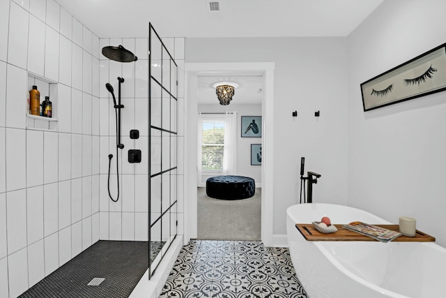 full bathroom with tile patterned flooring, a soaking tub, tiled shower, and visible vents