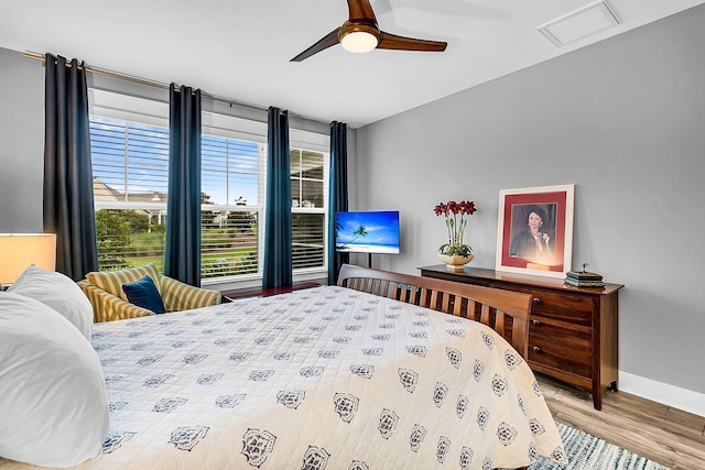 bedroom with hardwood / wood-style floors and ceiling fan