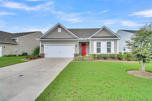 ranch-style home featuring a garage and a front yard