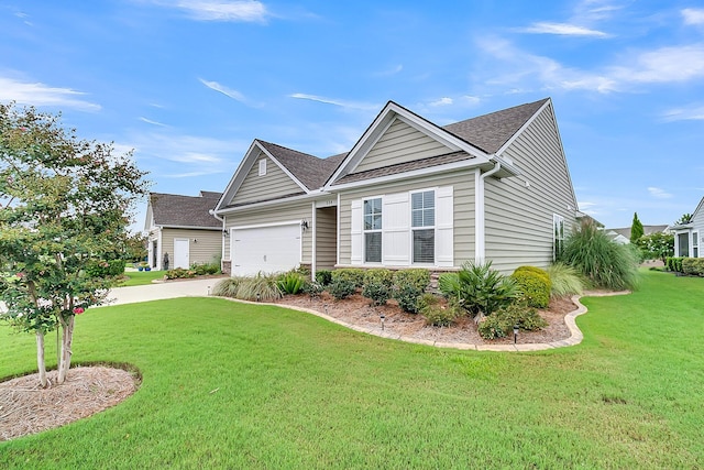 view of front facade with a garage and a front lawn