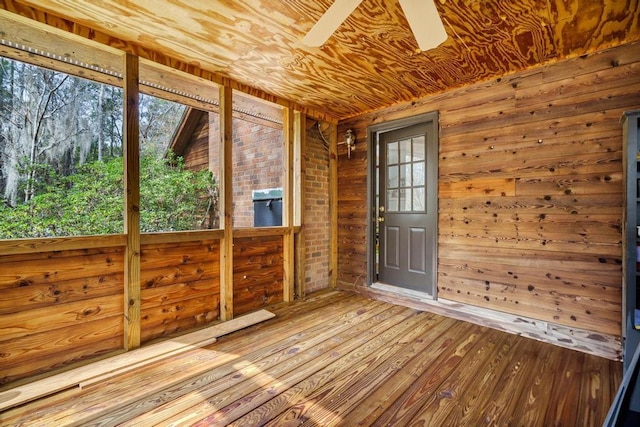 unfurnished sunroom with wooden ceiling