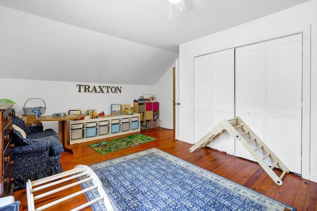 recreation room featuring vaulted ceiling and wood finished floors