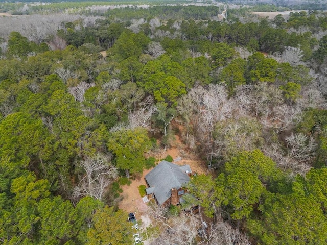 drone / aerial view featuring a wooded view