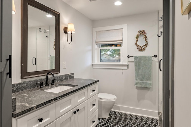 bathroom with tile patterned flooring, a shower stall, toilet, recessed lighting, and vanity