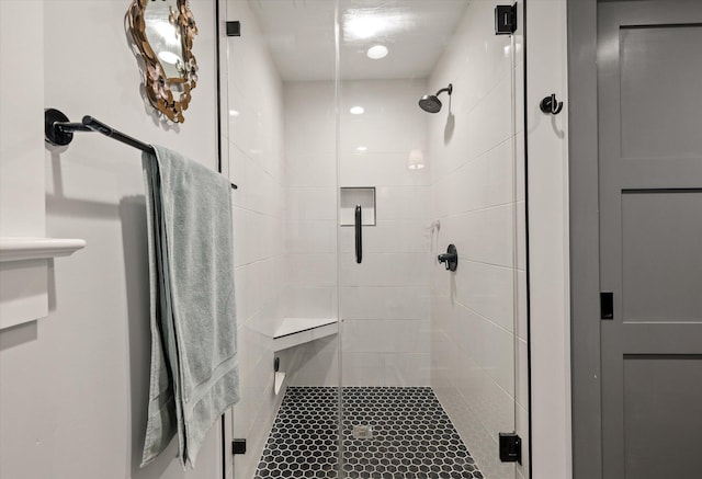 bathroom featuring a shower stall