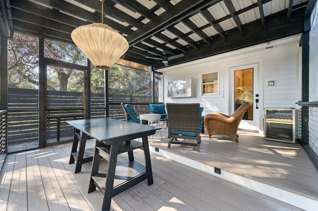 wooden terrace with outdoor dining space