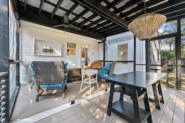 wooden terrace featuring a ceiling fan