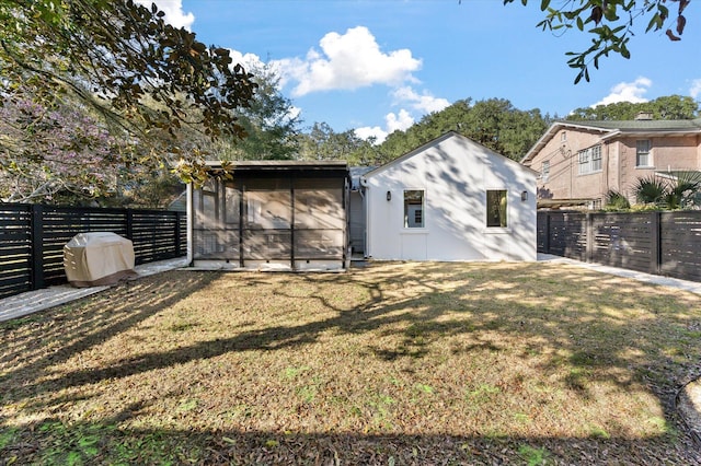 view of yard with a fenced backyard