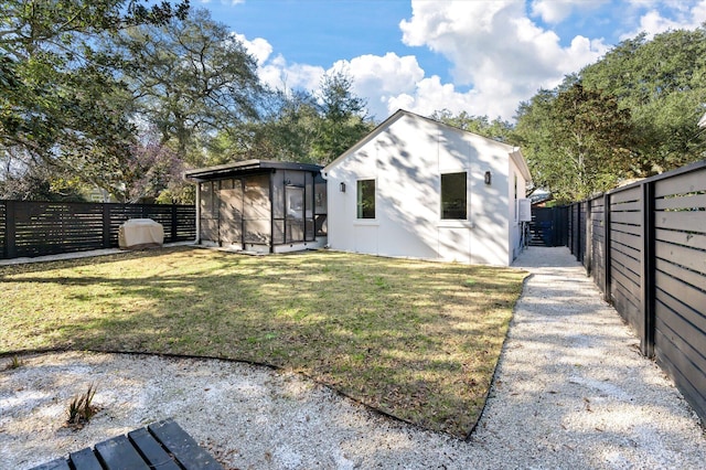 exterior space with a lawn and a fenced backyard