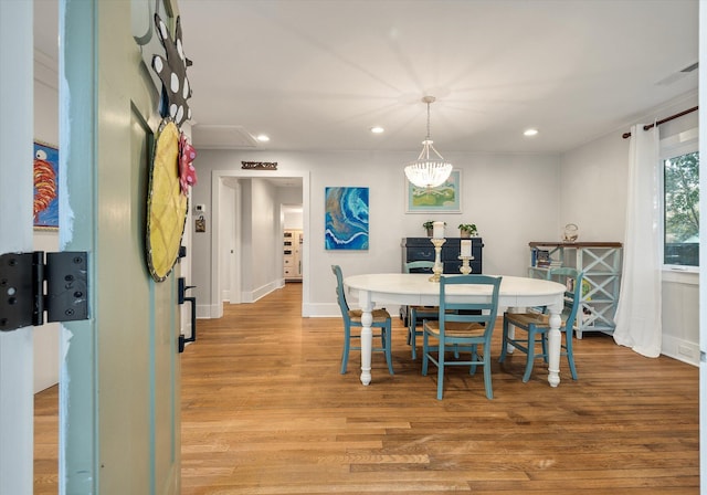 dining room featuring recessed lighting, baseboards, and light wood-style flooring