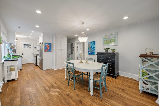 dining area with light wood finished floors, visible vents, recessed lighting, and baseboards