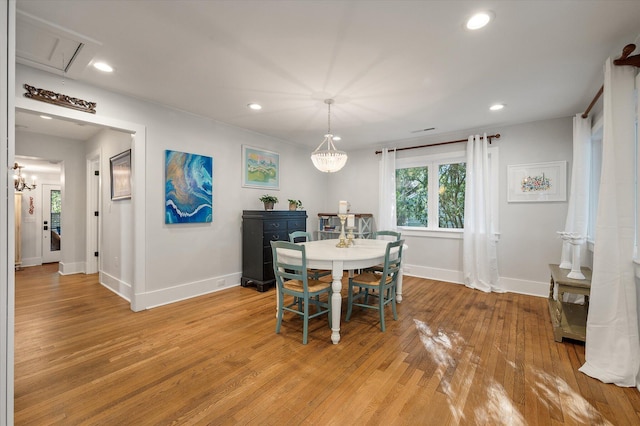 dining room featuring recessed lighting, baseboards, and light wood-style floors