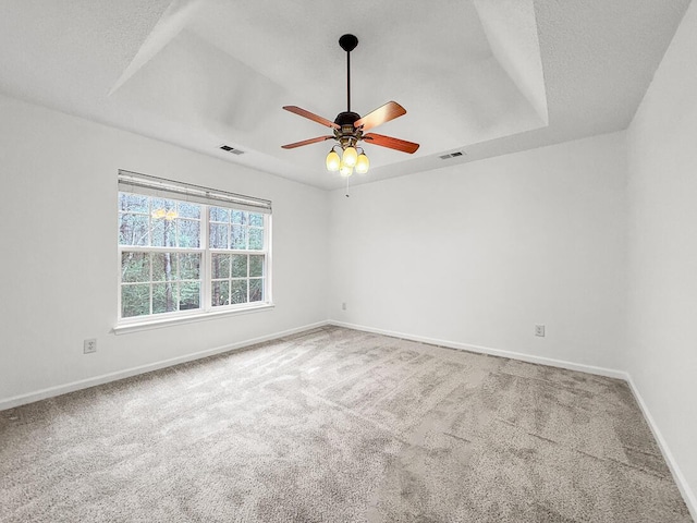 empty room with ceiling fan and carpet floors