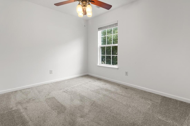 spare room with ceiling fan and carpet floors