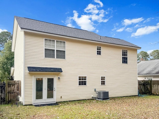 back of property featuring central AC unit