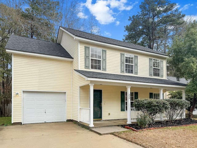 view of front of house with a porch and a garage