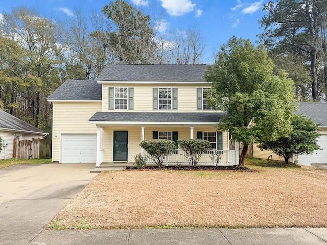 view of front of property featuring a garage and covered porch