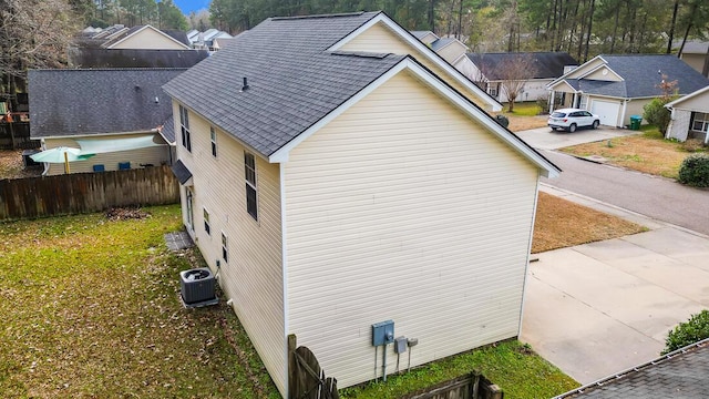 view of side of home featuring cooling unit