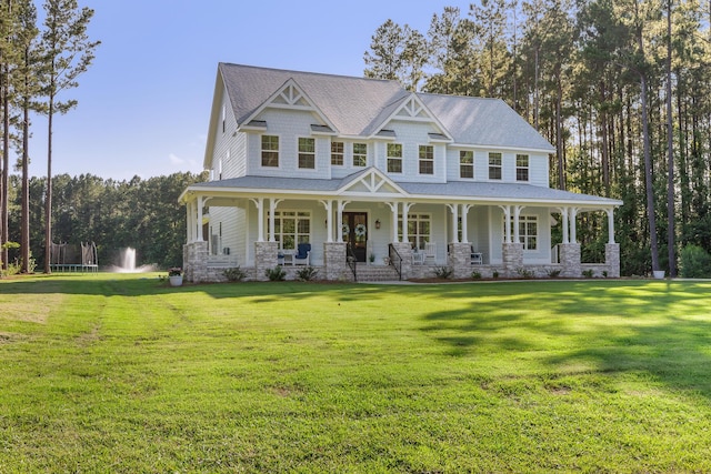 1130 Plantation Overlook Dr, Moncks Corner, SC 29461 - view of front facade featuring a front lawn, covered porch, stone siding, and roof with shingles