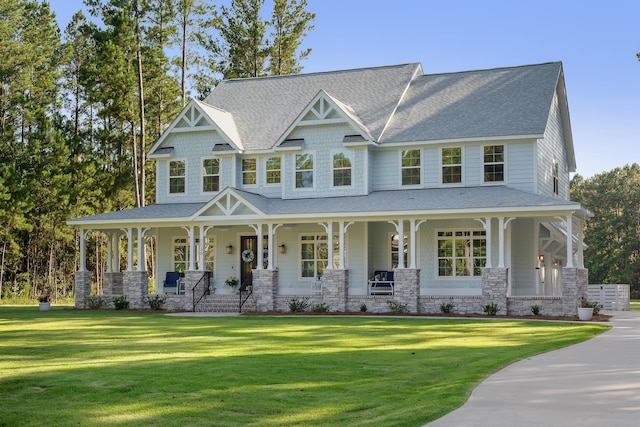 1130 Plantation Overlook Dr, Moncks Corner, SC 29461 - view of front of house with a porch, roof with shingles, a front yard, and stone siding