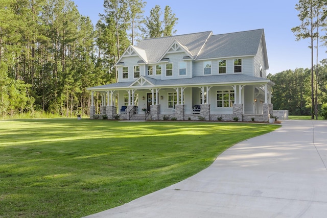 1130 Plantation Overlook Dr, Moncks Corner, SC 29461 - view of front of home with covered porch, stone siding, a front lawn, and a shingled roof