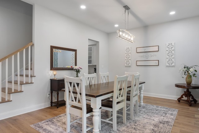 1130 Plantation Overlook Dr, Moncks Corner, SC 29461 - dining room with wood finished floors, stairway, and recessed lighting