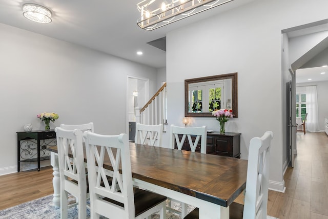 1130 Plantation Overlook Dr, Moncks Corner, SC 29461 - dining area with wood finished floors, recessed lighting, a chandelier, and stairway