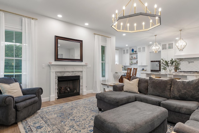1130 Plantation Overlook Dr, Moncks Corner, SC 29461 - living area featuring a chandelier, light wood-type flooring, recessed lighting, and a fireplace