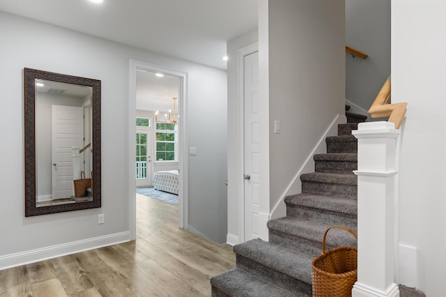 1130 Plantation Overlook Dr, Moncks Corner, SC 29461 - stairs featuring wood finished floors, recessed lighting, and a chandelier