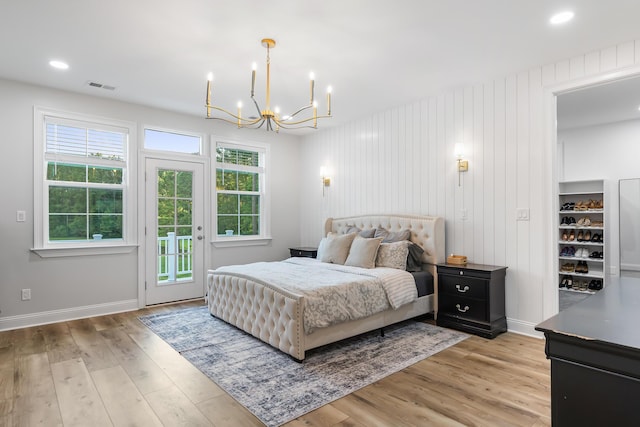 1130 Plantation Overlook Dr, Moncks Corner, SC 29461 - bedroom featuring access to exterior, a chandelier, multiple windows, light wood-style flooring, and recessed lighting