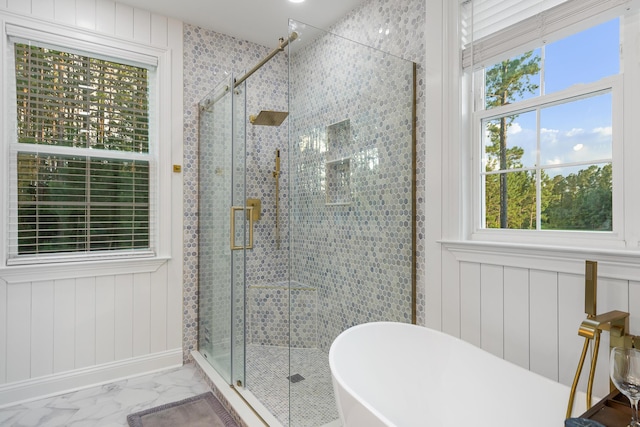 1130 Plantation Overlook Dr, Moncks Corner, SC 29461 - bathroom with plenty of natural light, a soaking tub, marble look tiles, and a shower stall