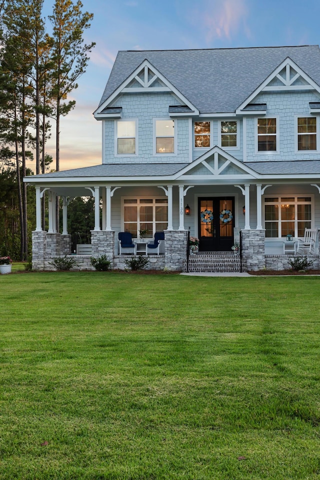 1130 Plantation Overlook Dr, Moncks Corner, SC 29461 - view of front facade with a porch, a shingled roof, and a yard