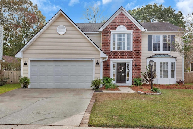 view of front of home featuring a garage, concrete driveway, fence, a front lawn, and brick siding