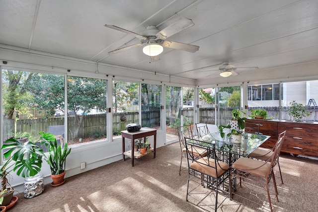 sunroom / solarium with plenty of natural light and a ceiling fan