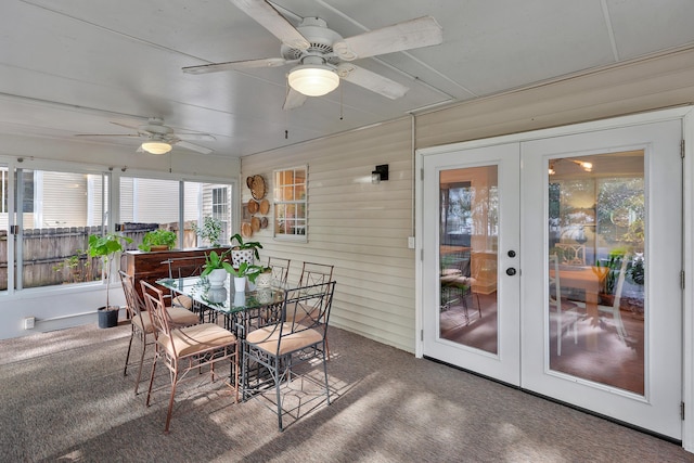 sunroom featuring ceiling fan and french doors