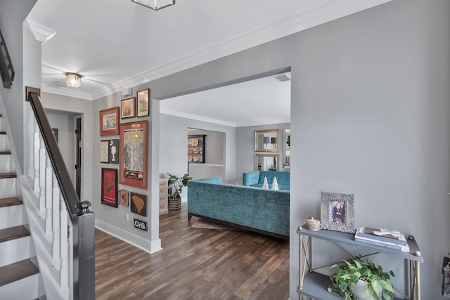 entrance foyer featuring baseboards, visible vents, stairway, ornamental molding, and wood finished floors