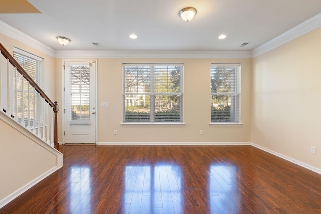 foyer entrance featuring crown molding and dark wood-type flooring