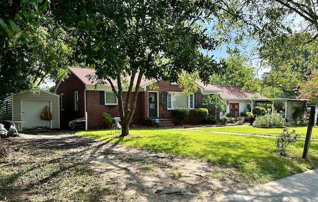 single story home featuring a storage unit and a front yard