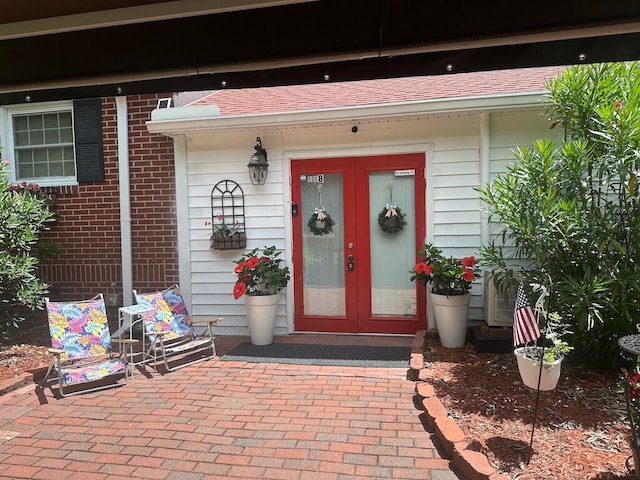 view of exterior entry featuring french doors