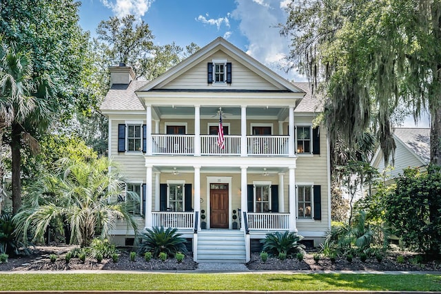 view of front of property featuring a porch and a balcony