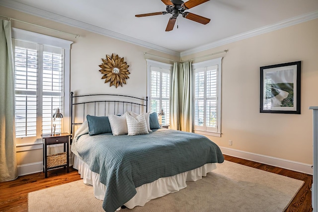 bedroom featuring ceiling fan, ornamental molding, and wood-type flooring