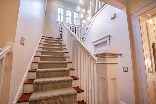 stairs featuring ornamental molding