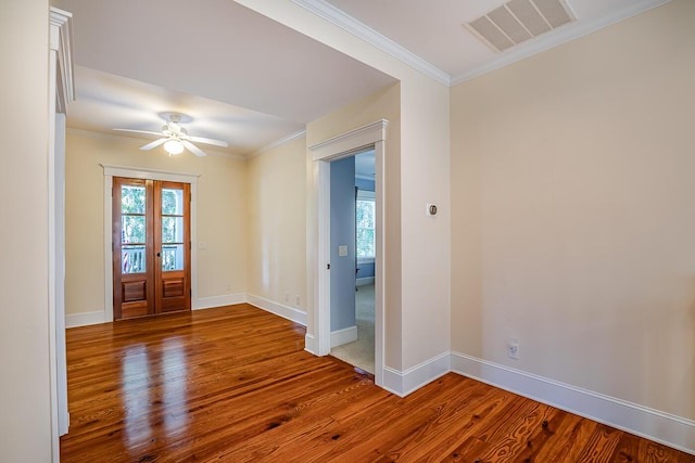 foyer entrance featuring ceiling fan, french doors, a wealth of natural light, and hardwood / wood-style flooring