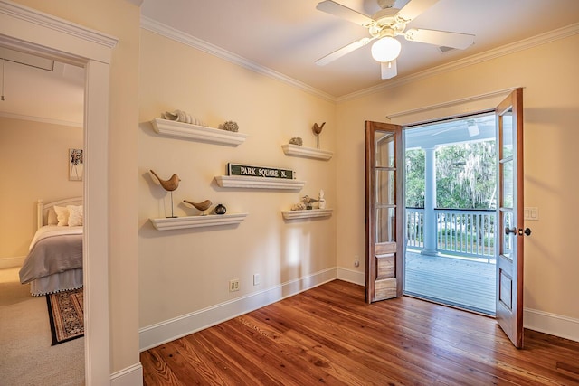 doorway to outside with ceiling fan, crown molding, and hardwood / wood-style flooring