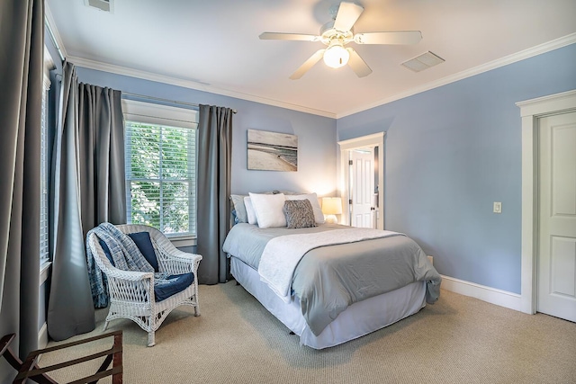 bedroom with ornamental molding, ceiling fan, and light carpet