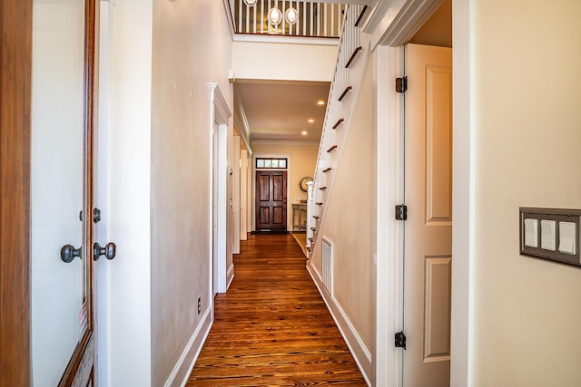 hall featuring dark hardwood / wood-style flooring and crown molding