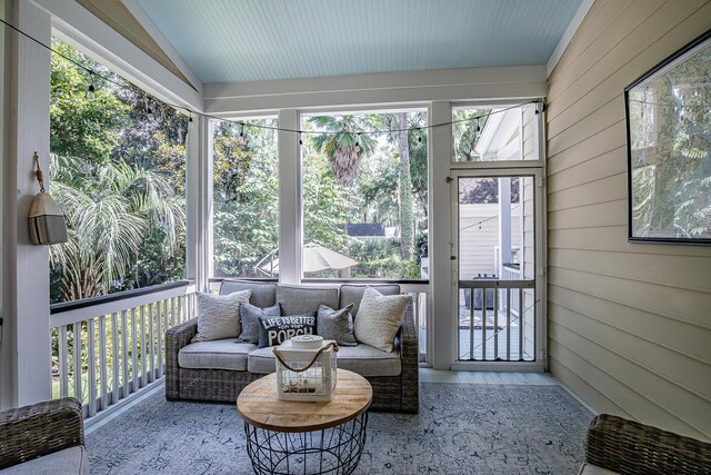 sunroom / solarium with lofted ceiling