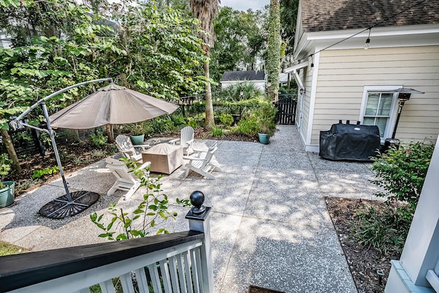 view of patio featuring a fire pit and area for grilling